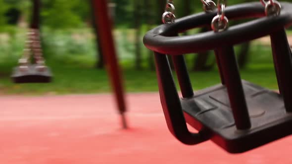 Black Childrens Swing for Toddlers Swing in the Summer Park