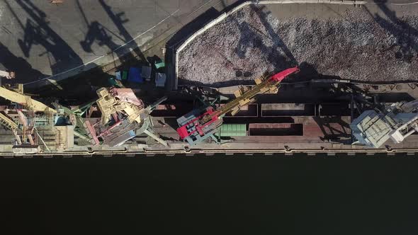 View from the top to the commercial port, cranes are working, chagun's grave. International shipping alt