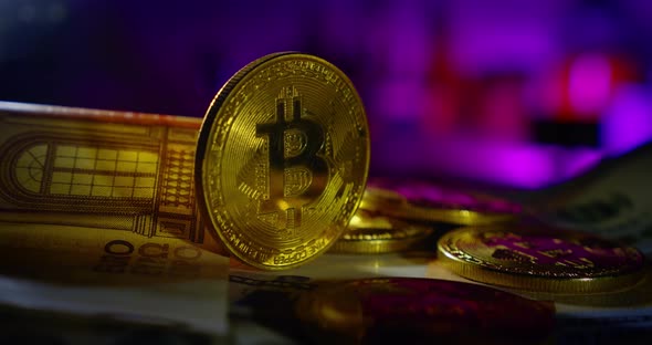 the Bitcoin Coin Rotates, Along with Other Money. Close Up alt