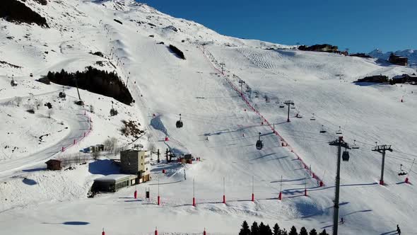 Aerial View of the Alps Mountains in France. Mountain Tops Covered in Snow. Alpine Ski Facilities