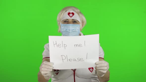 Elderly Female Doctor in Medical Mask Show Page with Message. Coronavirus alt