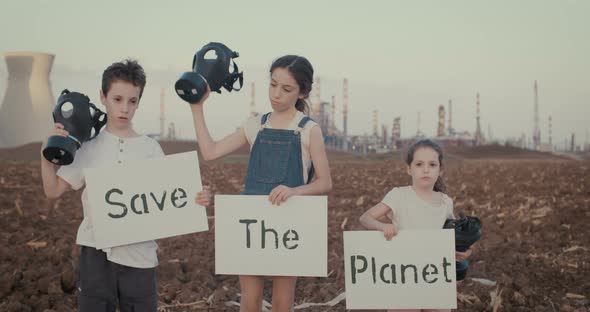 climate change crisis. Kids wearing gas masks near an oil refinery alt