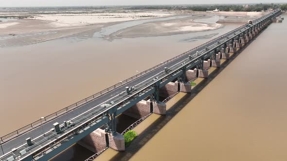 Aerial View Of Punjnad Barrage Dam Structure. Dolly Shot alt