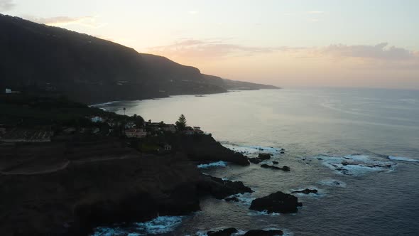 Aerial capture of Punta del Guindastes while flying over it during the sunset, Tenerife alt