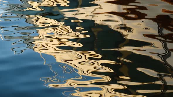 Abstract magical golden colored sea surface as slow motion