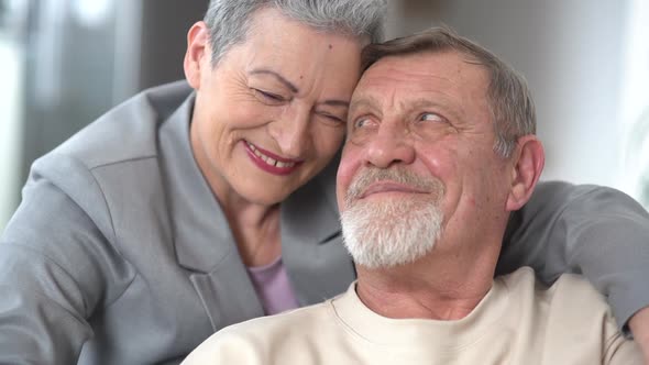Tenderness and Love in the Relationship of an Elderly Grayhaired Couple alt