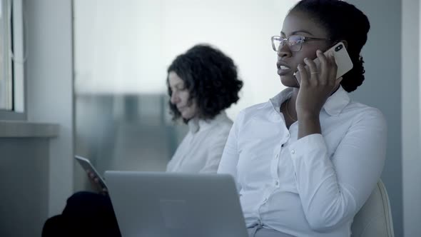 Multiethnic Businesswomen Using Digital Devices alt