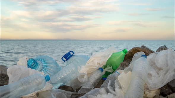 Timelapse. Plastic Bottles in a Polluted. Clouds Background alt
