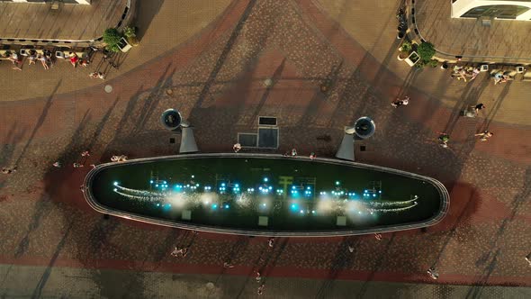 Top View of the City Fountain in the New District of Minsk Mayak Hot Summer and Vacationing People alt
