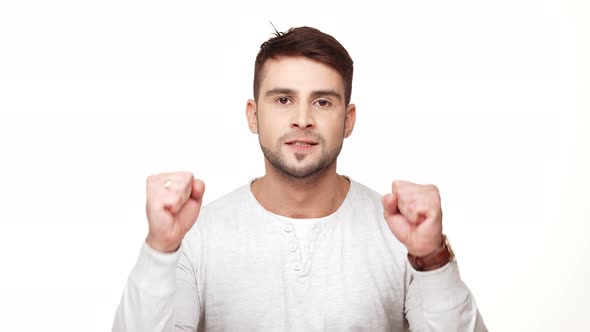 Concentrated Tough Guy in Shirt Rejoicing on White Background alt