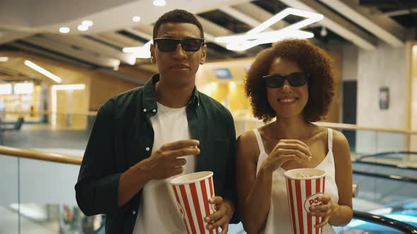 Young People in 3D Glasses and Popcorn Came to the Cinema alt
