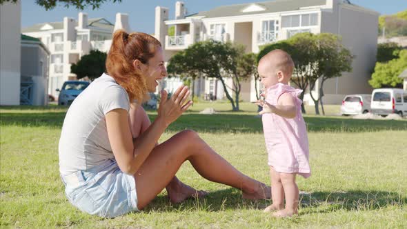 Happy Moms and Baby on a Walk in the Park alt