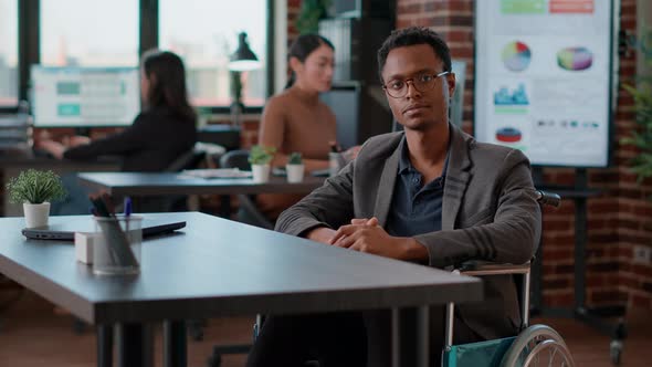 POV of Businessman with Disability Attending Videocall Meeting alt