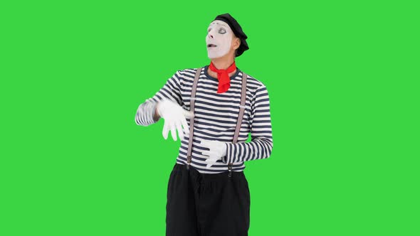 Mime Artist Holding Imaginary Balloons and Flying on a Green Screen Chroma Key alt