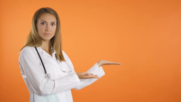 Women Doctor Advertises Something Needed for Healthcare, Points with Both Fingers, Isolated on alt