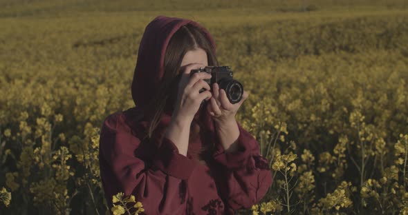 Outdoors Portrait of Girl Photographing Nature on Vintage Camera Handheld Device, Young Woman