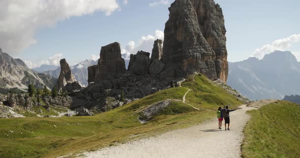 Man and Woman Couple Hiking Along Cinque Torri Trail Path