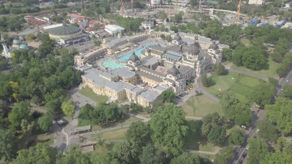 Aerial view of swimming pool Szechenyi Thermal Bath and Spa in Budapest city, Hungary. Green park