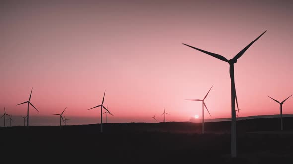 Pink Sunset Wind Turbines Windmills Produce Green Alternative Source of Electricity Energy