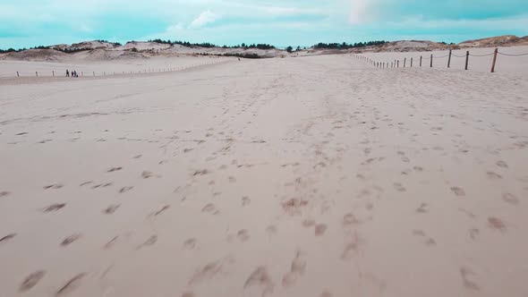 Sand dunes from drone. Amazing sea desert. Beautiful sky.