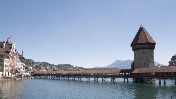 One of the Main Attractions of the Swiss Lucerne - the Chapel Bridge and the Tower Wasserturm in the