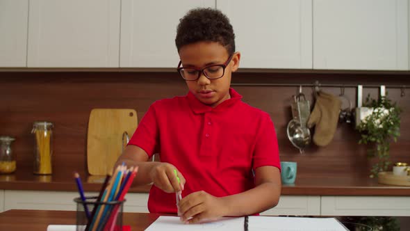 Smart Cute School Age African American Boy Drawing Circle with Divider Compass alt