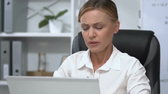 Businesswoman Working on Laptop Suddenly Feeling Sharp Neck Pain, Health Problem