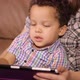 Mom Teaches a Child To Work With The Tablet - VideoHive Item for Sale