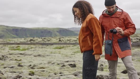 Hiking Couple In Moss Covered Landscape alt