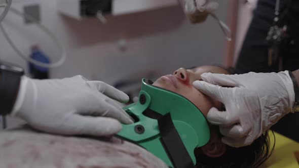 Ambulance Crew Shining Light Into Patient Eyes alt