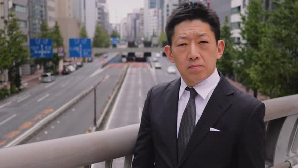 Portrait of a Japanese Businessman in Tokyo Japan alt