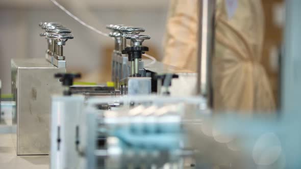 Production of Medical Masks - the Machine Makes Threads for Ear Loops on the Mask alt