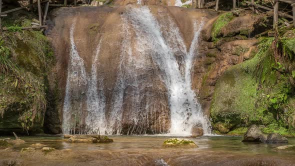 Beautiful waterfall in the mountains alt