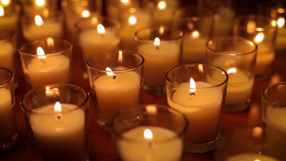 Rows of candles in a church or temple. alt