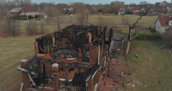Drone view of dilapidated house in a Detroit neighborhood. This video was filmed in 4k for best imag alt