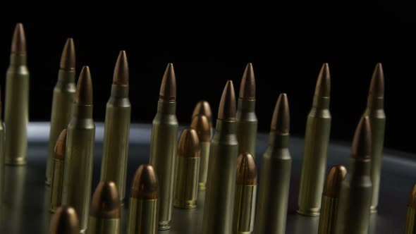 Cinematic rotating shot of bullets on a metallic surface - BULLETS 074 ...