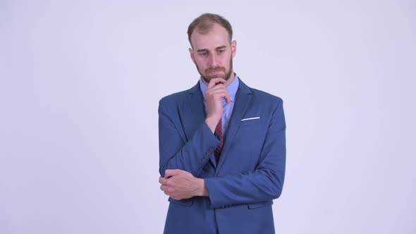 Stressed Bearded Businessman Thinking and Looking Down
