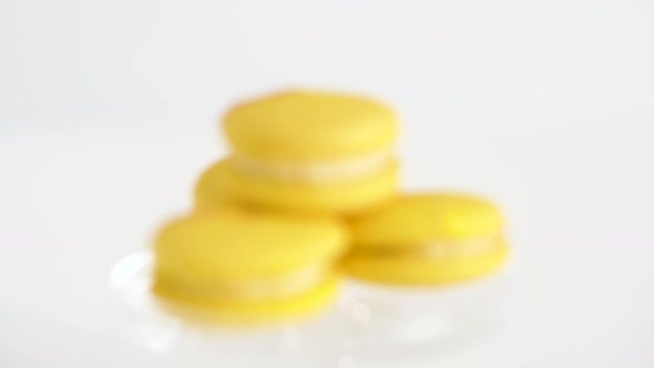 Lemon Yellow Macarons on Glass Confectionery Stand alt