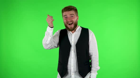 Man Waving Hand and Showing Gesture Come Here. Green Screen alt