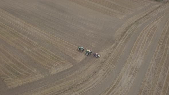 Aerial view of tractor on agriculture field Countryside, village rural landscape, Bordeaux France