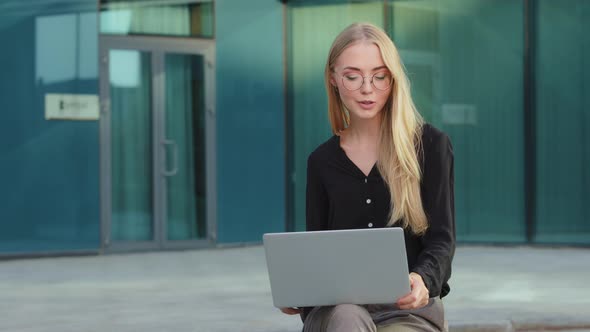 Portrait of Smiling Young Caucasian Female Employee in Glasses Work Outdoor alt