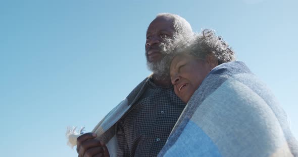 Senior couple enjoying free time at the beach alt