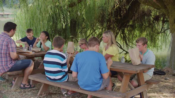 Kids at outdoor school having lunch together