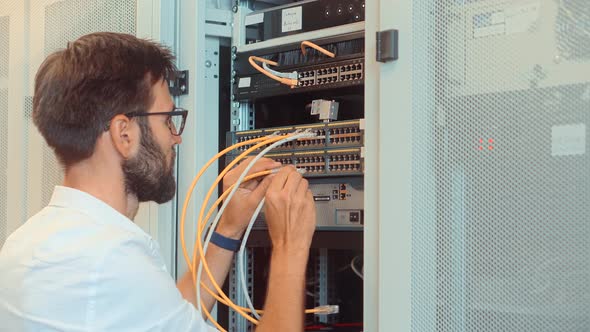 Admin Repairing Render Farm. Engineer On Cluster Console In Artificial Intelligence Server Room. alt