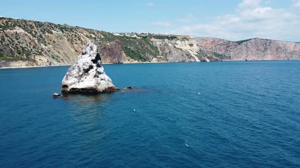 Aerial View From Above on Azure Sea and Volcanic Rocky Shores alt