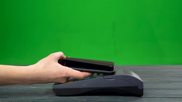 Paying in a Trade with a Smartphone Device Wirelessly Then Dials the Code and Gets the Check Against alt