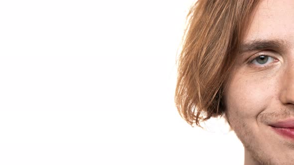 Half Side Portrait of Caucasian Unshaved Guy Looking at Camera with Happy Smile Near Copy Space alt