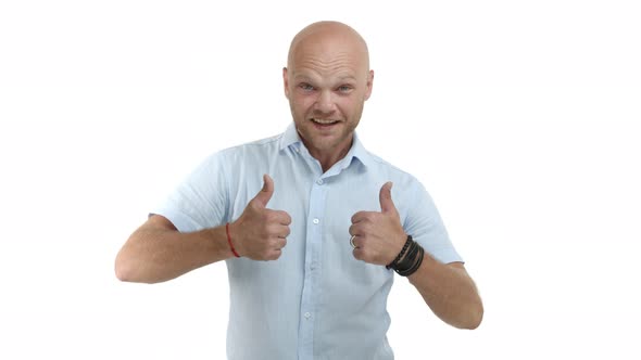 Handsome Bald Guy with Beard Wearing Blue Shirt Appear From Bottom and Showing Thumbsup Recommend alt