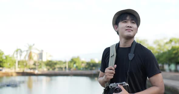 Happy Man walking and resting at park alt