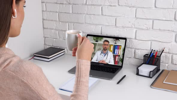 Man doctor in laptop screen talk consults online conference video call laptop alt